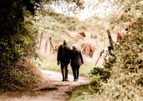 Elderly Couple Walking in the Park