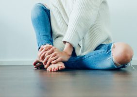 Woman sitting on the floor