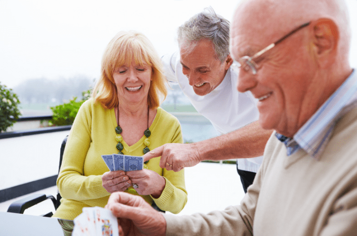 Friends playing cards at home