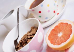 Cup of tea, bowl of bran flakes and half a grapefruit