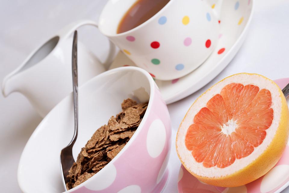 Cup of tea, bowl of bran flakes and half a grapefruit