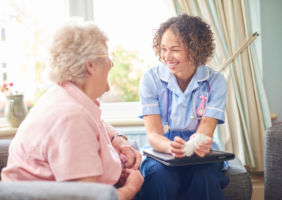 Elderly woman in nursing home with nurse