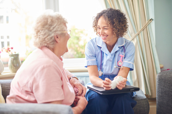 Elderly woman in nursing home with nurse