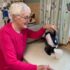 Elderly woman making tea with her tilt-to-pour Uccello Kettle