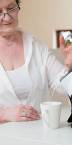 Elderly Woman using the Uccello Kettle to make tea